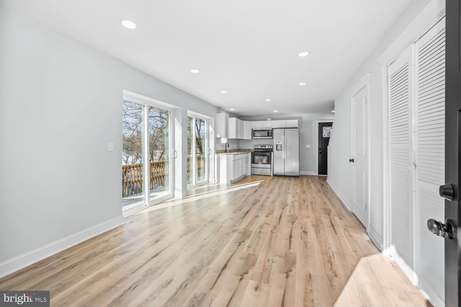 13306 Greensboro Road Greensboro, MD 21639 - Photo 7 of 48 a view of empty room with wooden floor and windows