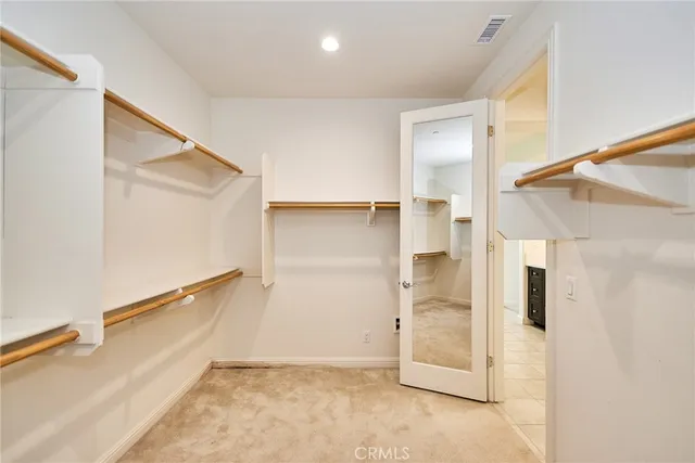 an aerial view of a house with balcony and garden