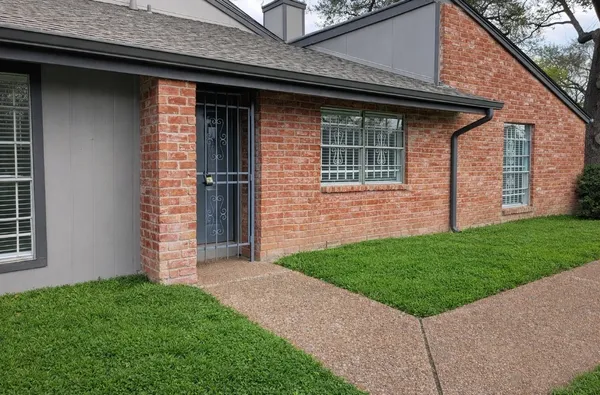 a view of a backyard of the house