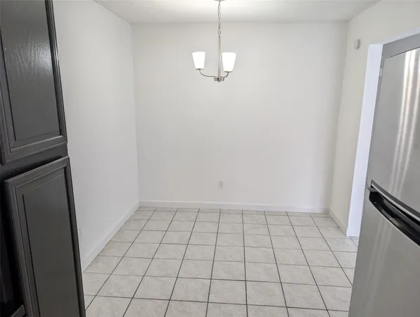 a kitchen with stainless steel appliances a refrigerator and a sink