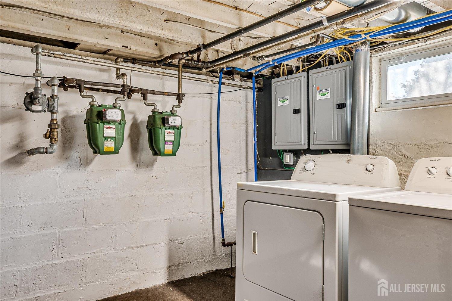 385 Pierson Avenue, Unit 2 Edison, NJ 08837 - Photo 16 of 18 a utility room with dryer and washer