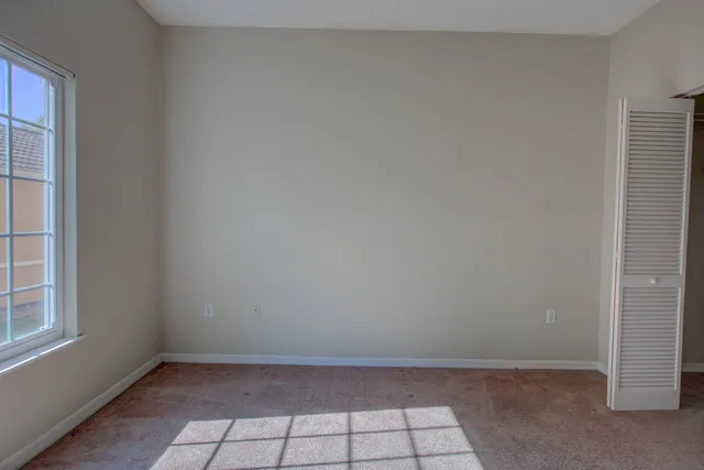 a white bath tub sitting next to a white toilet and a shower