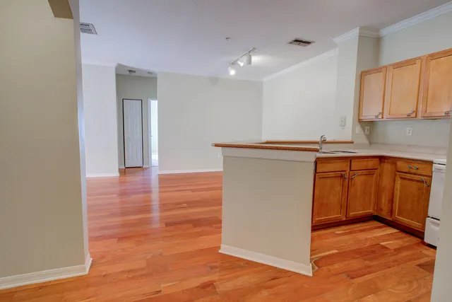 a kitchen with stainless steel appliances a refrigerator stove and microwave