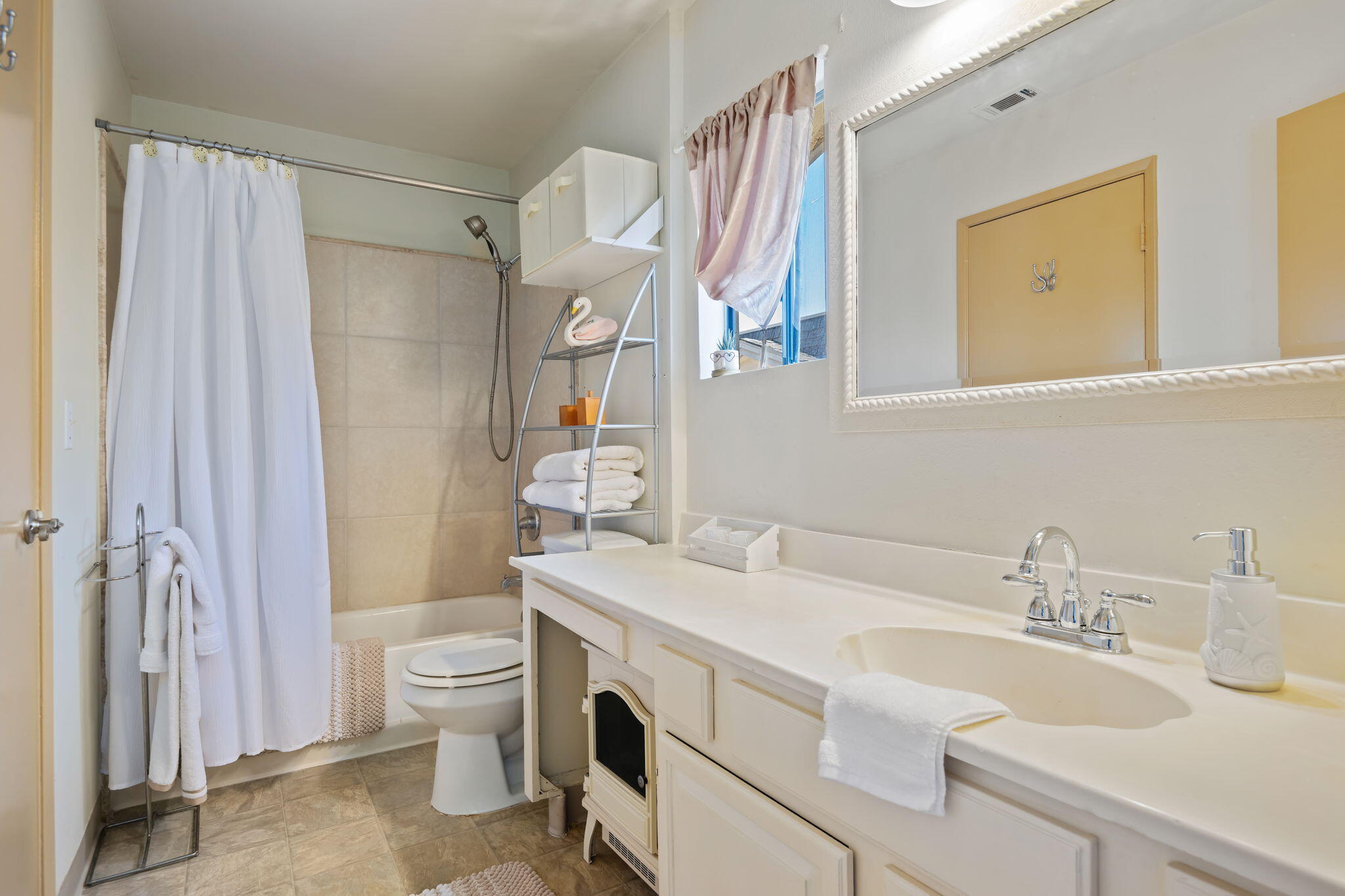 543 South E Street Oxnard, CA 93030 - Photo 19 of 30 a bathroom with a sink toilet and shower