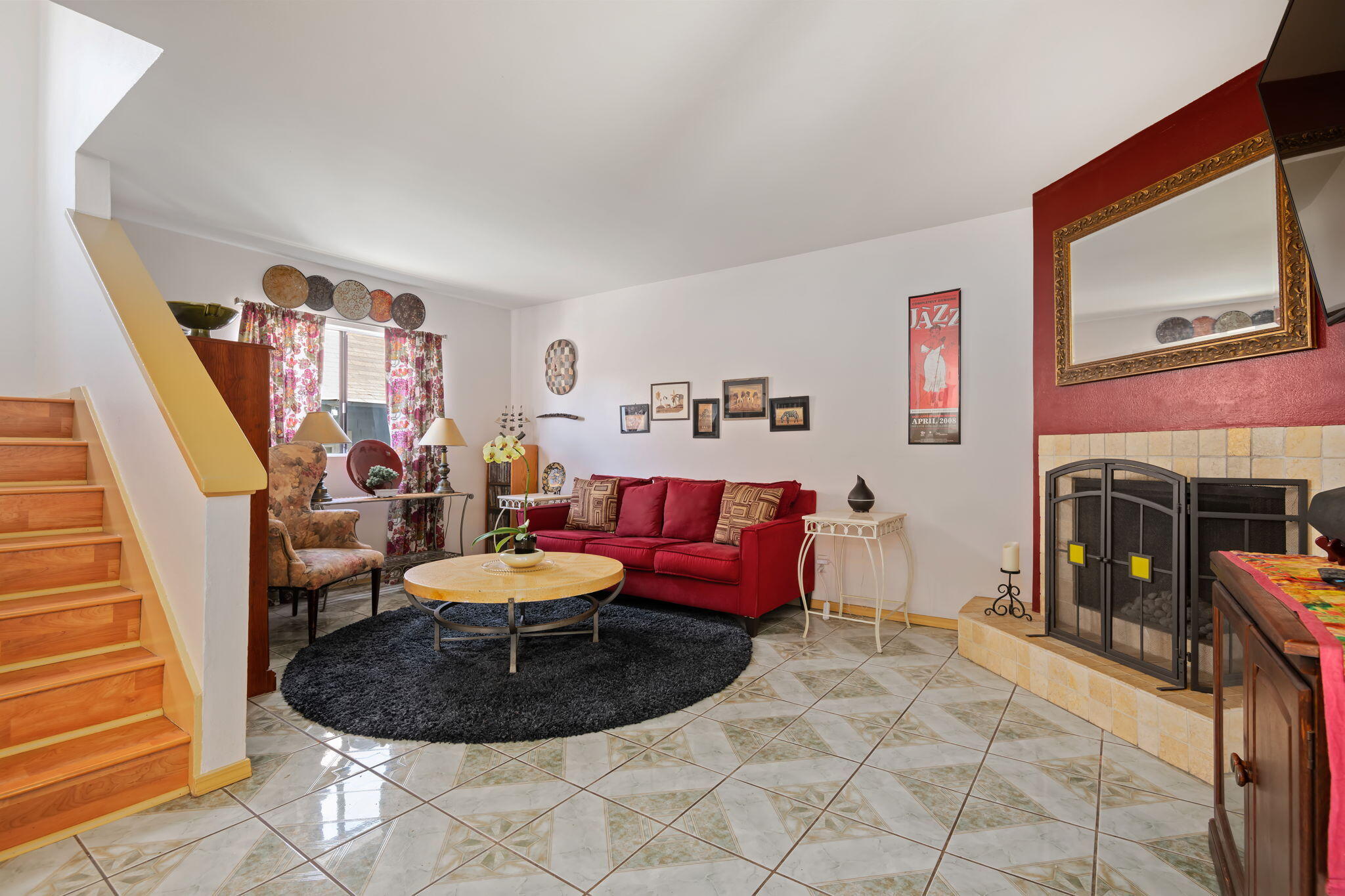 543 South E Street Oxnard, CA 93030 - Photo 3 of 30 a living room with furniture a fireplace and a flat screen tv