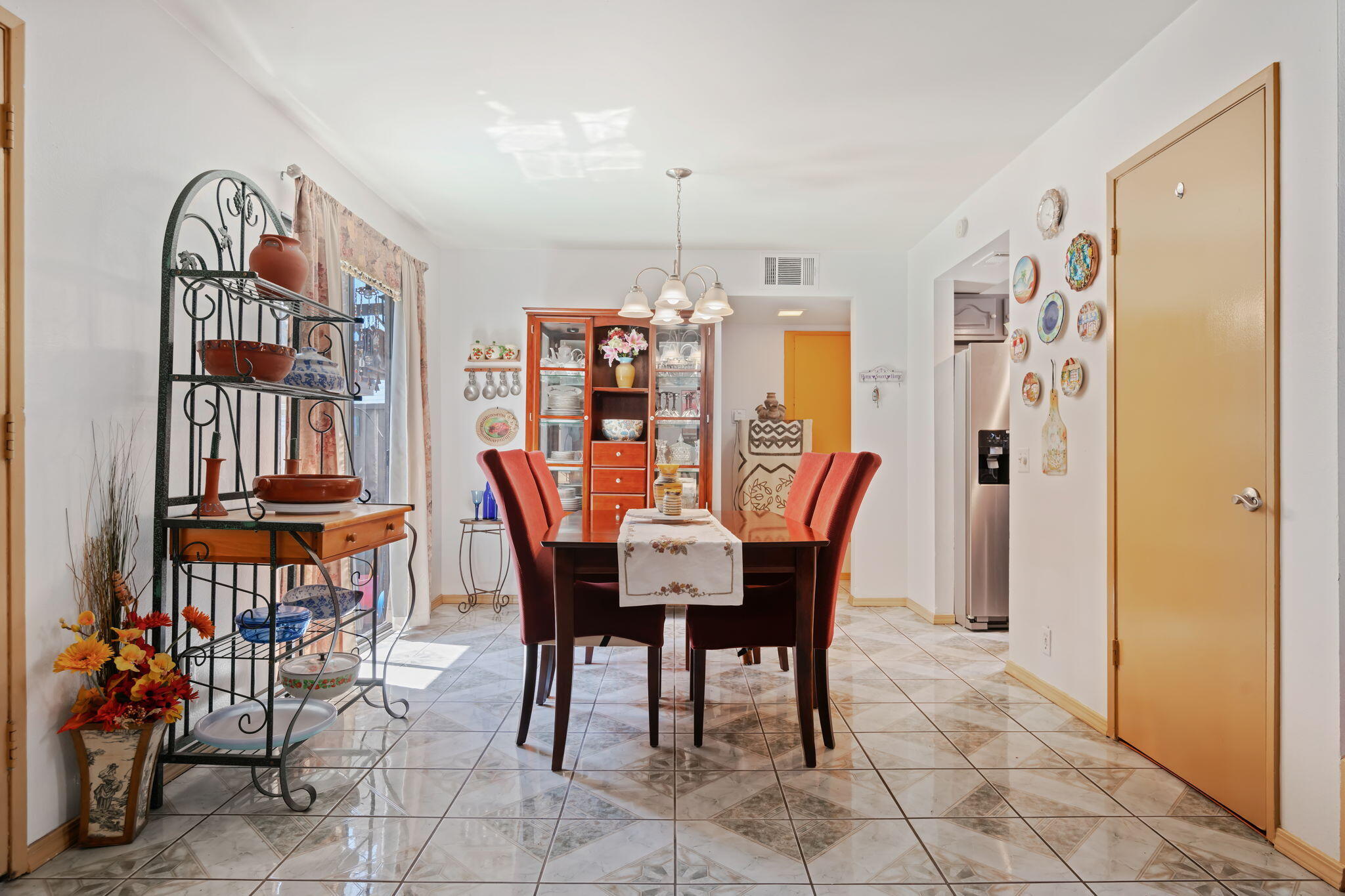 543 South E Street Oxnard, CA 93030 - Photo 8 of 30 a view of a dining room with furniture and chandelier