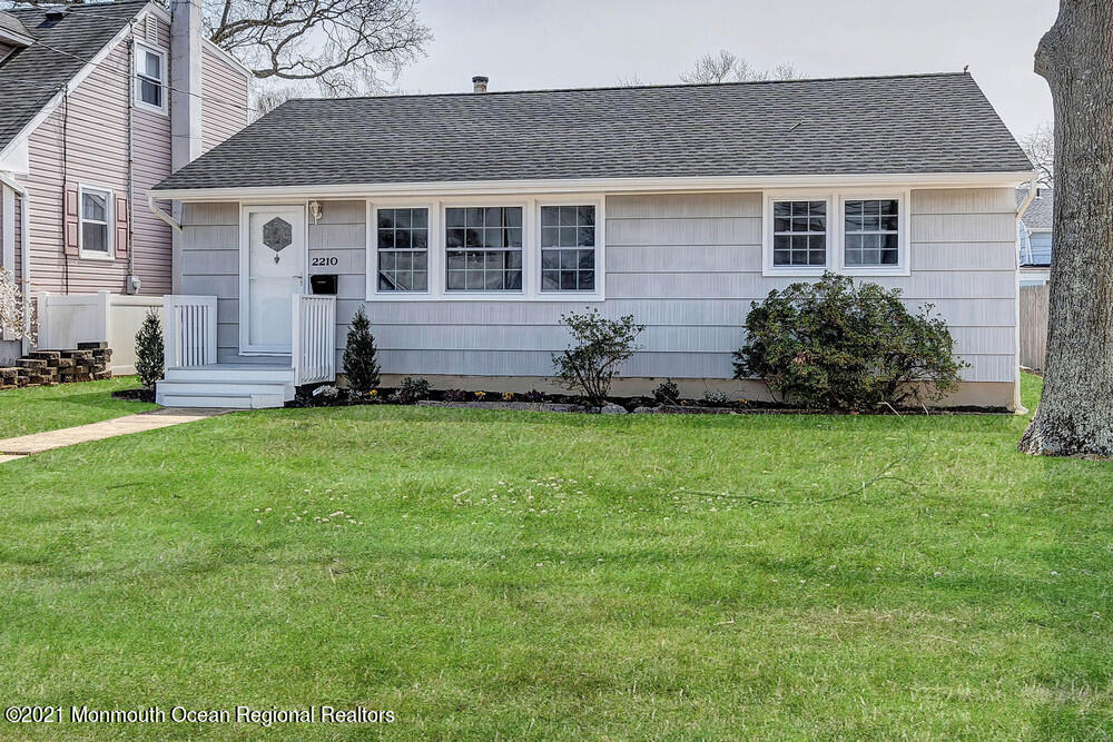 2210 Foster Road Point Pleasant, NJ 08742 - Photo 3 of 36 a front view of a house with a garden