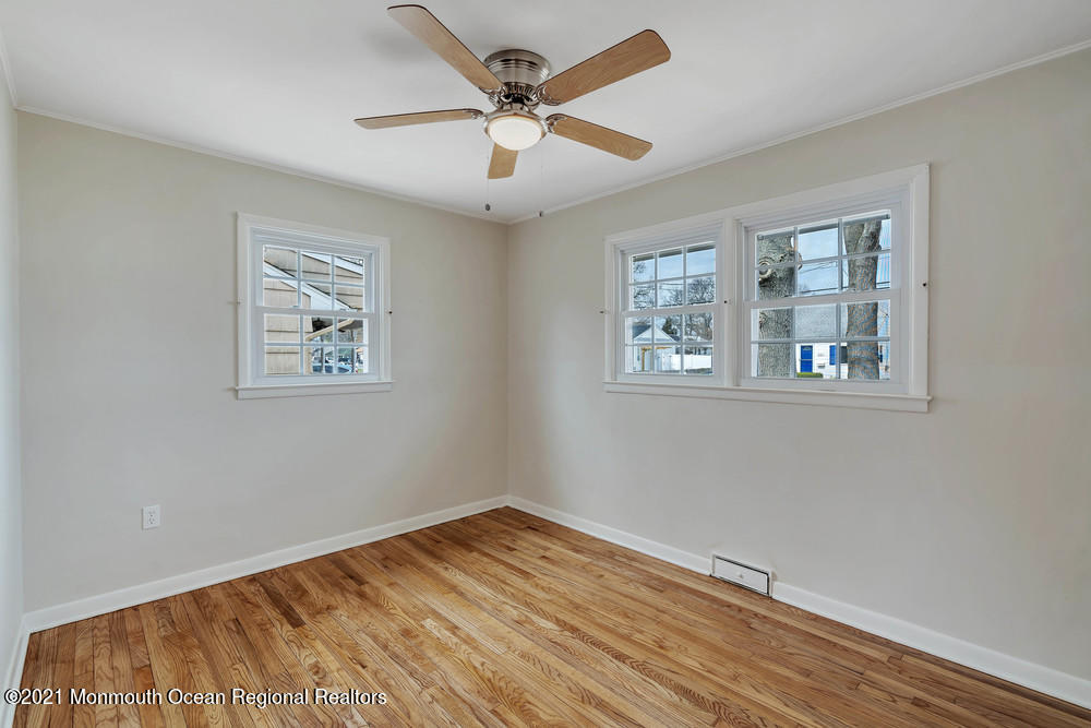 2210 Foster Road Point Pleasant, NJ 08742 - Photo 22 of 36 a view of empty room with wooden floor