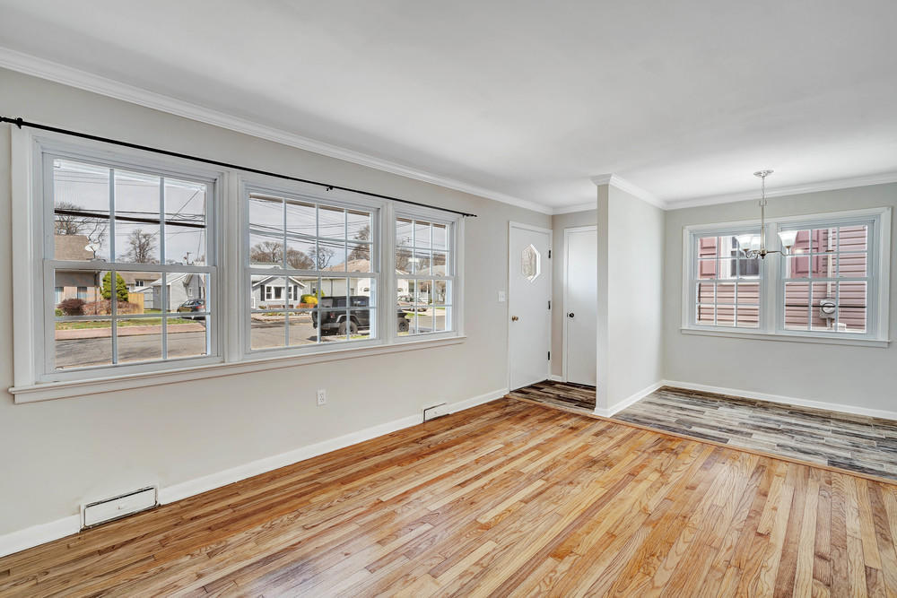 2210 Foster Road Point Pleasant, NJ 08742 - Photo 5 of 36 an empty room with wooden floor and windows