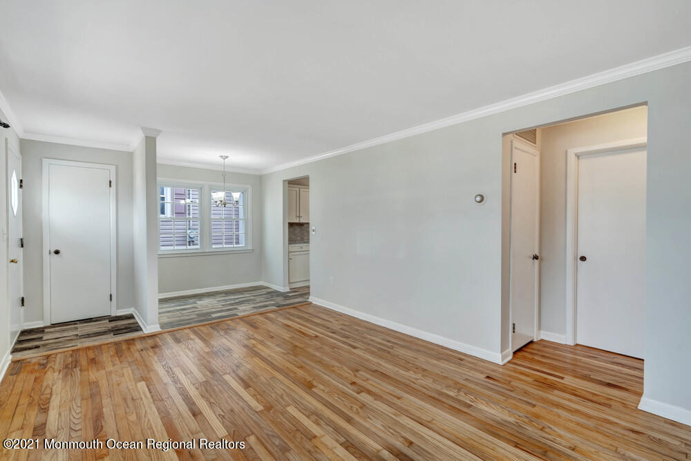 2210 Foster Road Point Pleasant, NJ 08742 - Photo 8 of 36 a view of an empty room with wooden floor and a window