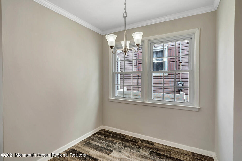 2210 Foster Road Point Pleasant, NJ 08742 - Photo 10 of 36 a view of wooden floor and a chandelier in a room