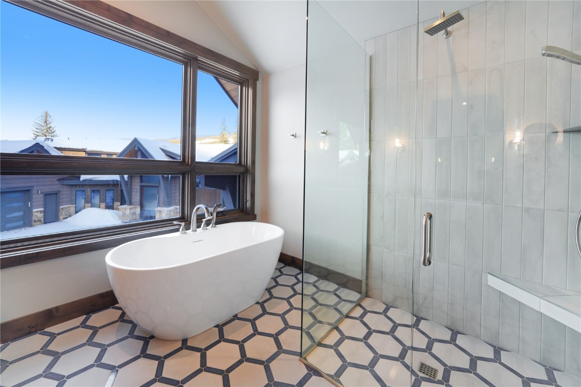 87 Independence Road Keystone, CO 80435 - Photo 17 of 25 a bathroom with a bathtub and shower