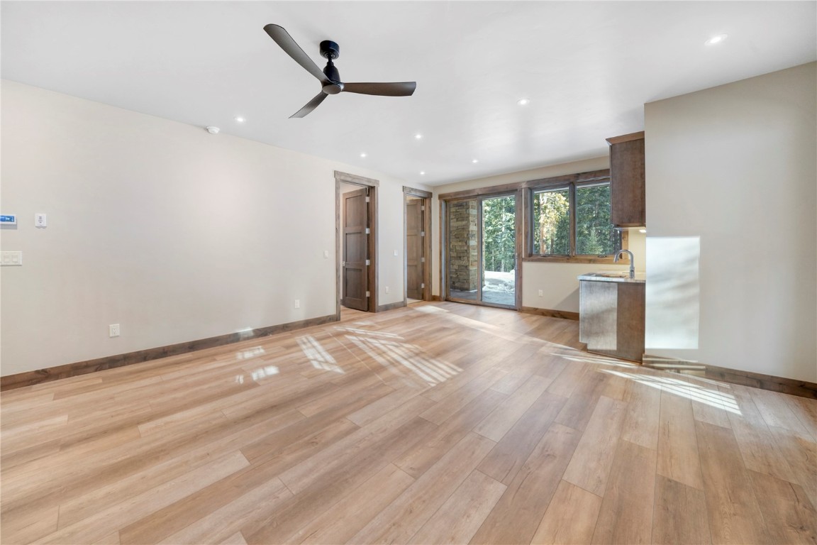 87 Independence Road Keystone, CO 80435 - Photo 20 of 25 a view of an empty room with a window and wooden floor