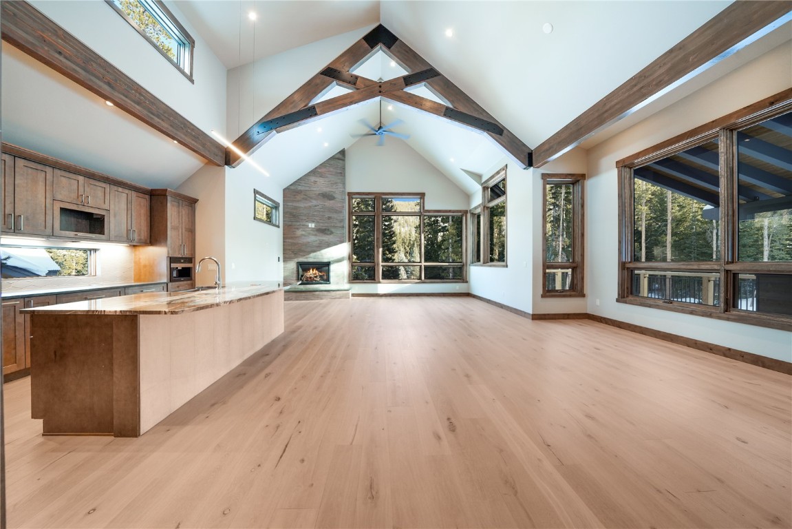 87 Independence Road Keystone, CO 80435 - Photo 2 of 25 a large white kitchen with wooden floors and wide window