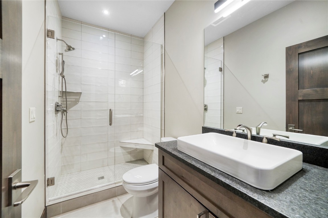 87 Independence Road Keystone, CO 80435 - Photo 21 of 25 a bathroom with a sink a toilet and shower