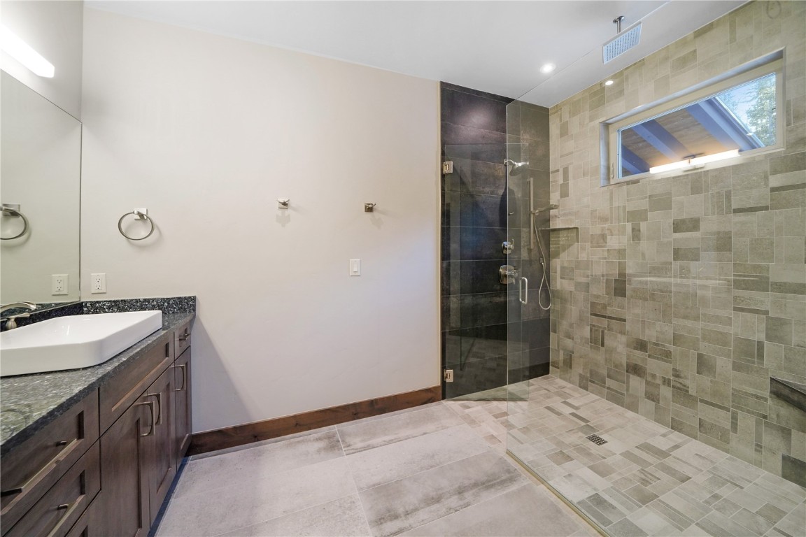 87 Independence Road Keystone, CO 80435 - Photo 22 of 25 a bathroom with a sink and a mirror