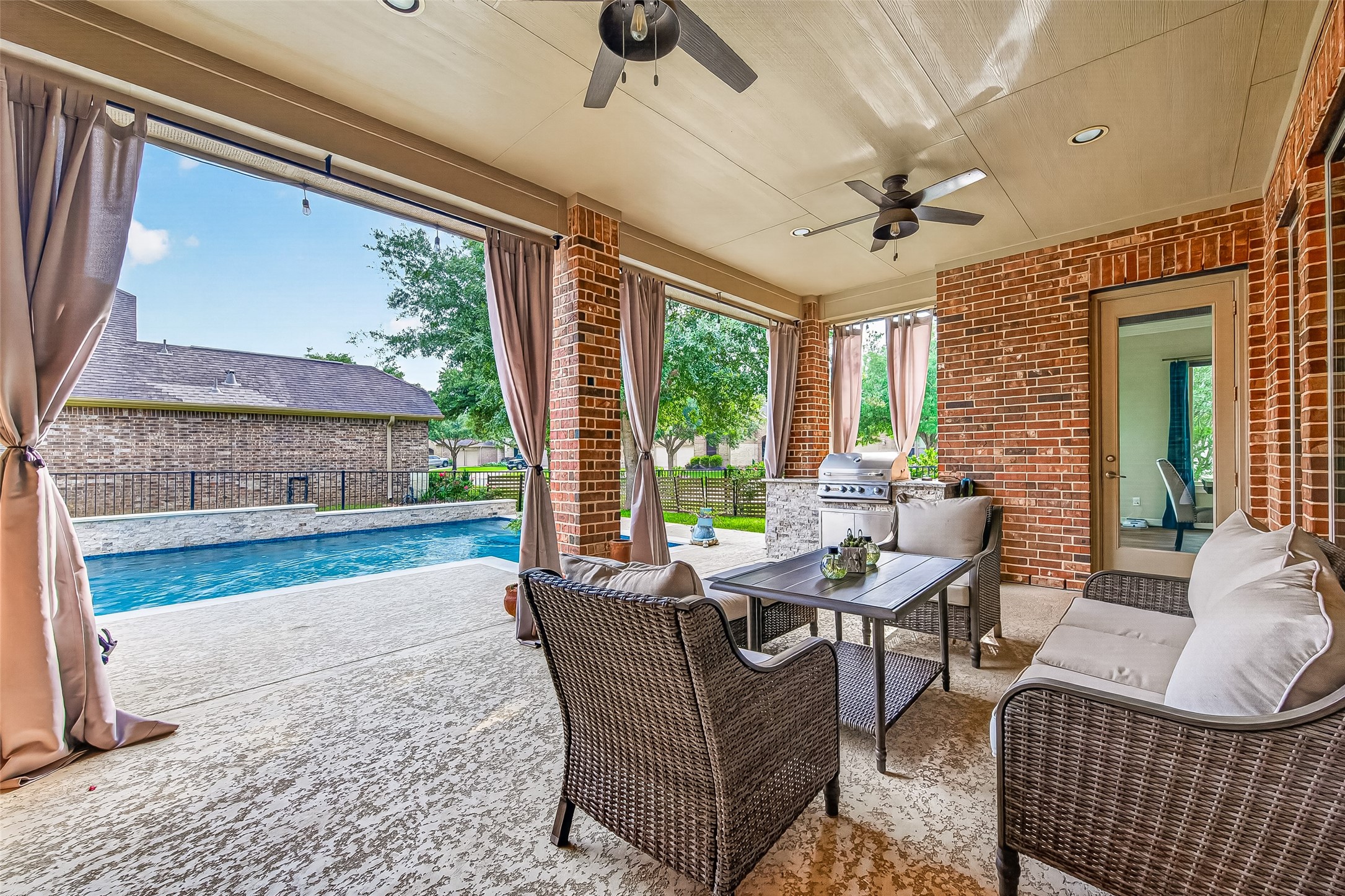 32607 Wingfoot Circle Fulshear, TX 77441 - Photo 36 of 39 Step outside onto the pack patio for a breath of fresh air and relaxation.
