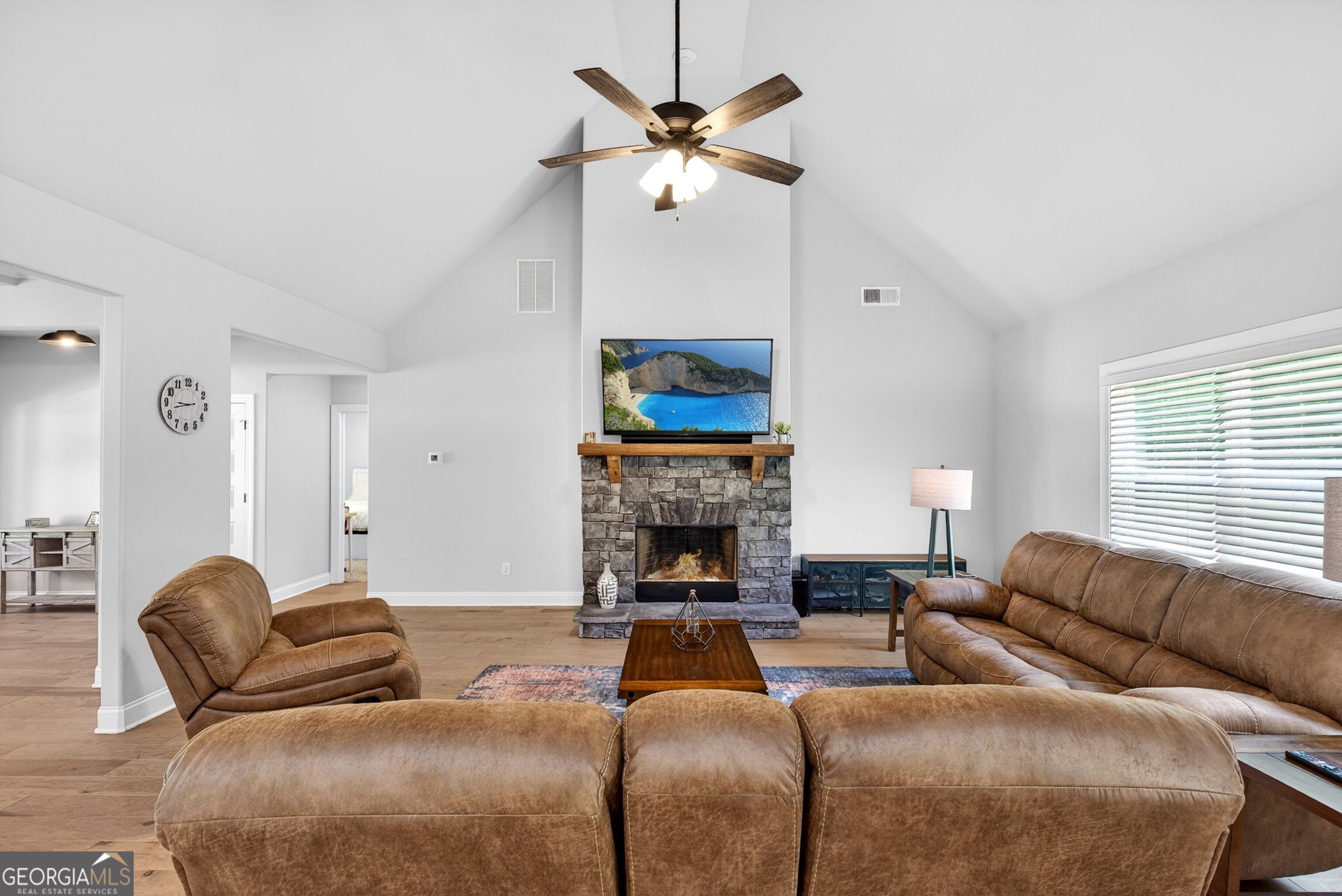 1764 Luther Bailey Road Senoia, GA 30276 - Photo 15 of 63 a living room with furniture a fireplace and a window