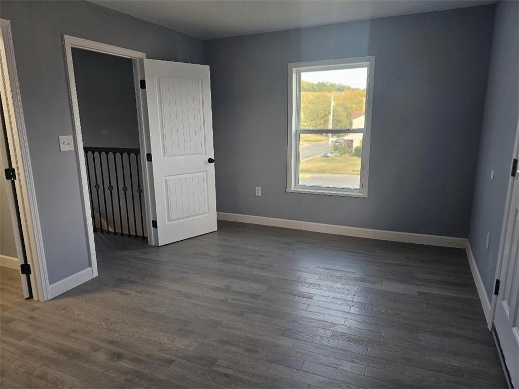 531 Reno Street Rochester, PA 15074 - Photo 8 of 11 an empty room with wooden floor and windows