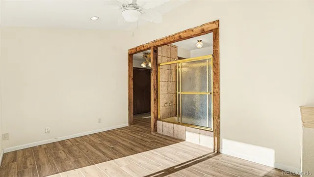 a bathroom with a mirror and a shower