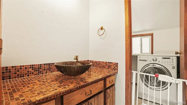 a view of living room with furniture and a window
