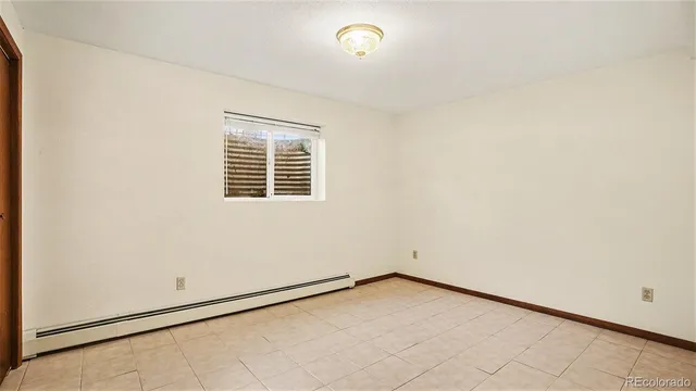 an empty room with a empty space and a window