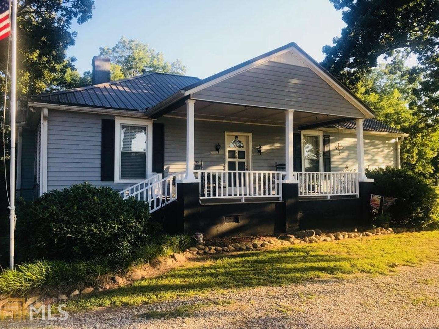 1544 Peeksville Road Locust Grove, GA 30248 - Photo 1 of 1 a view of a house with a yard and sitting area