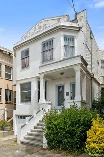 a front view of a house with a lots of windows