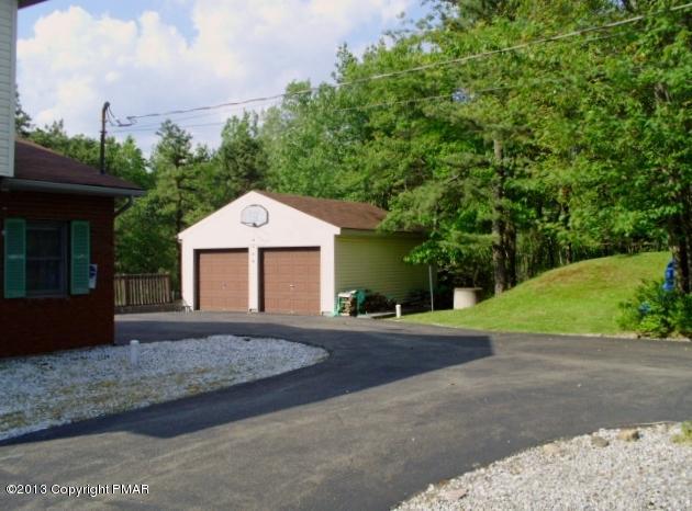 7229 Clover Road Long Pond, PA 18334 - Photo 22 of 22 a front view of a house with a yard and garage