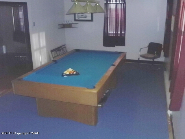 7229 Clover Road Long Pond, PA 18334 - Photo 8 of 22 a room with pool table and a chair