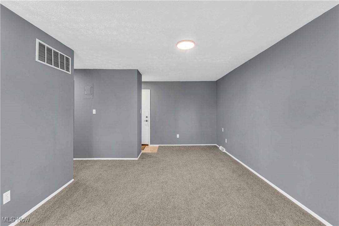 6640 Pearl Road, Unit 104 Cleveland, OH 44130 - Photo 14 of 31 Unfurnished room featuring carpet flooring and baseboards