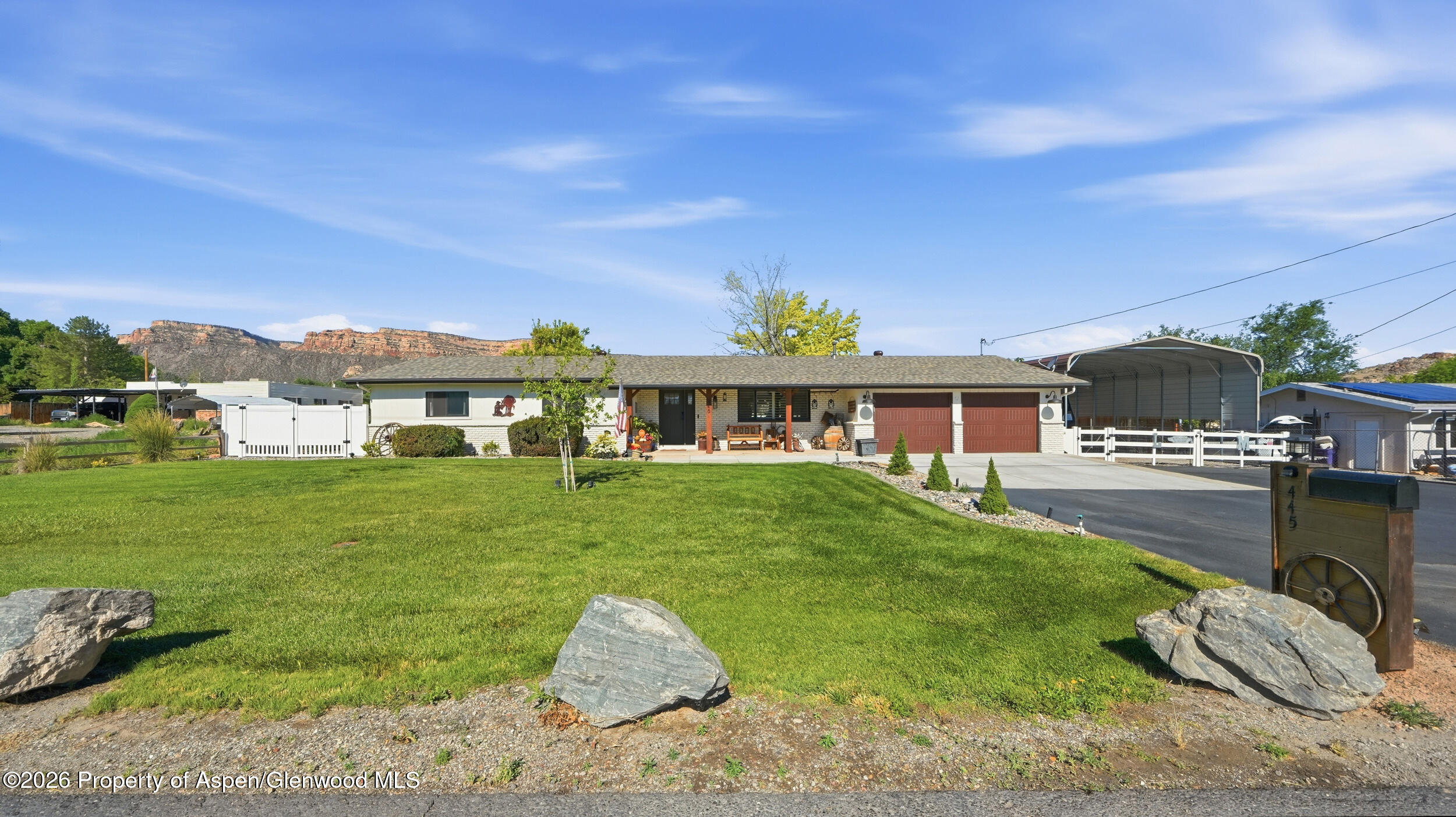 445 South Camp Road Grand Junction, CO 81507 - Photo 2 of 37 a front view of a house with garden