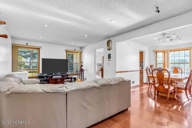 a living room with fireplace furniture and a flat screen tv