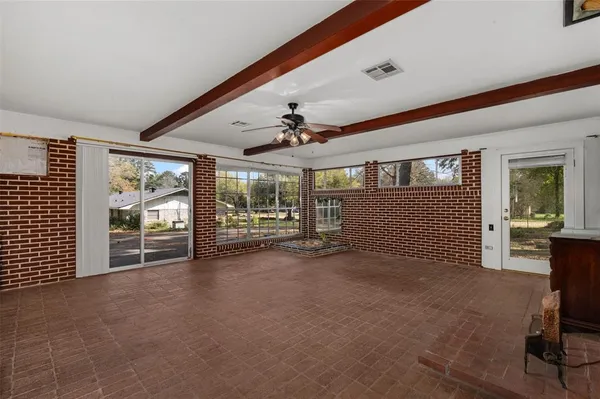 workspace with wooden floor and windows