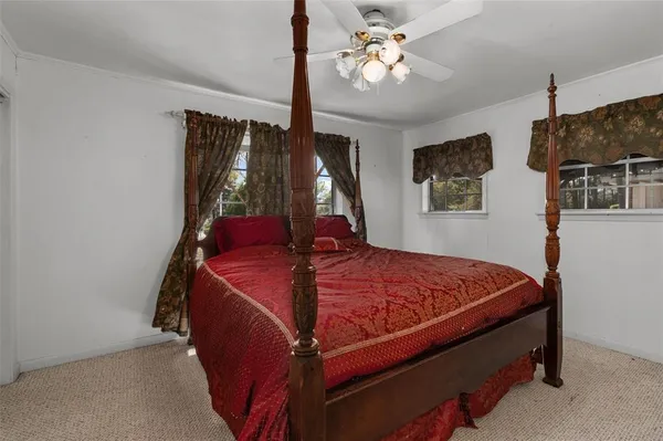 a bed room with a bed and a chandelier
