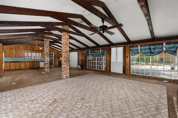 a view of a room with wooden walls