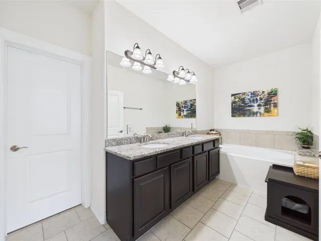 a living room with furniture a clock and a window