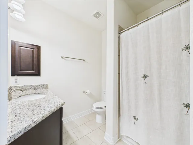 a bedroom with a bed and a walk in closet