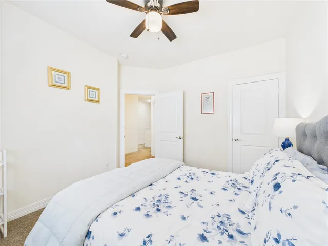 a bedroom with a bed and chair