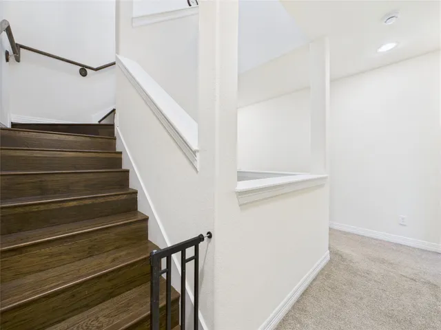a bathroom with a shower and toilet