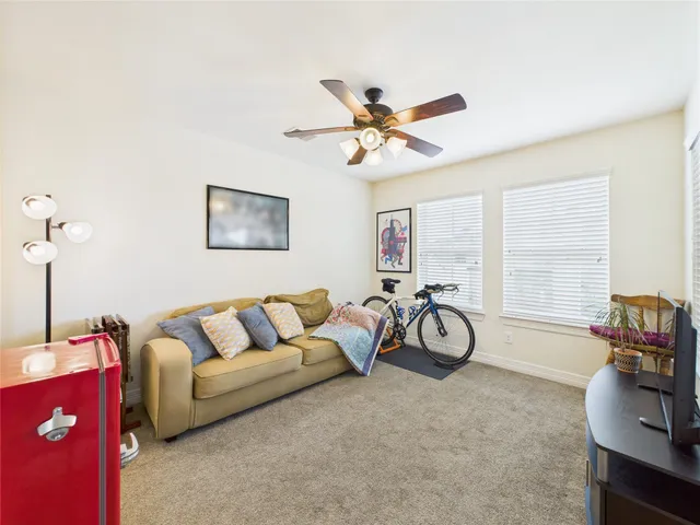 a view of a swimming pool with sitting area
