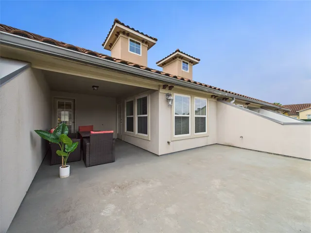 an aerial view of a house with a lake view