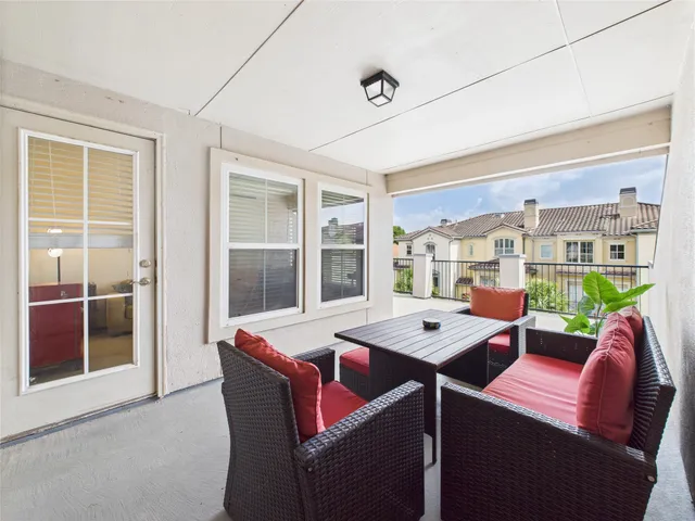 an aerial view of residential building with outdoor space and lake view