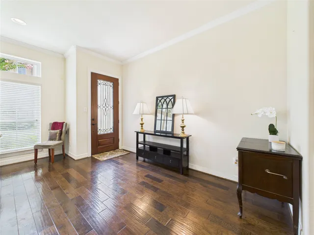 a living room with furniture fireplace and window
