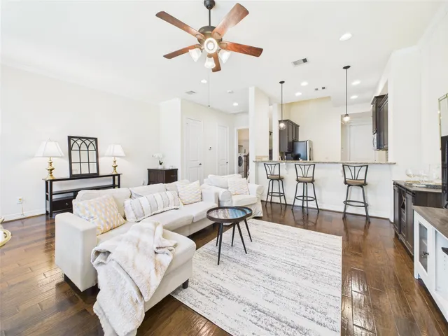 a kitchen with stainless steel appliances granite countertop a refrigerator sink and stove