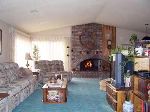 9450 Bittner Road Yakima, WA 98901 - Photo 2 of 9 a living room with furniture and a fireplace