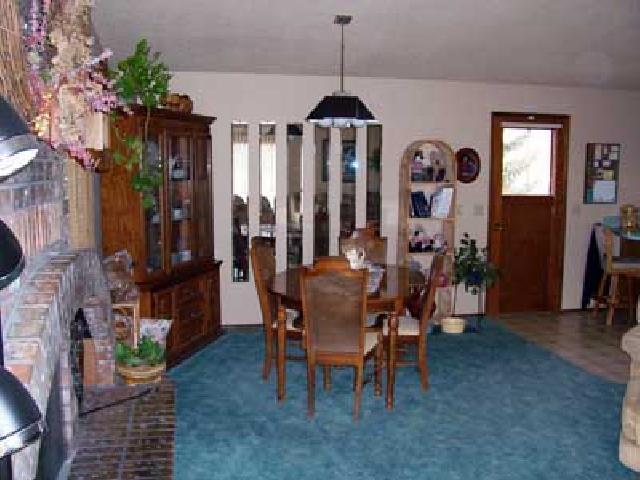 9450 Bittner Road Yakima, WA 98901 - Photo 3 of 9 a view of a dining room with furniture and chandelier