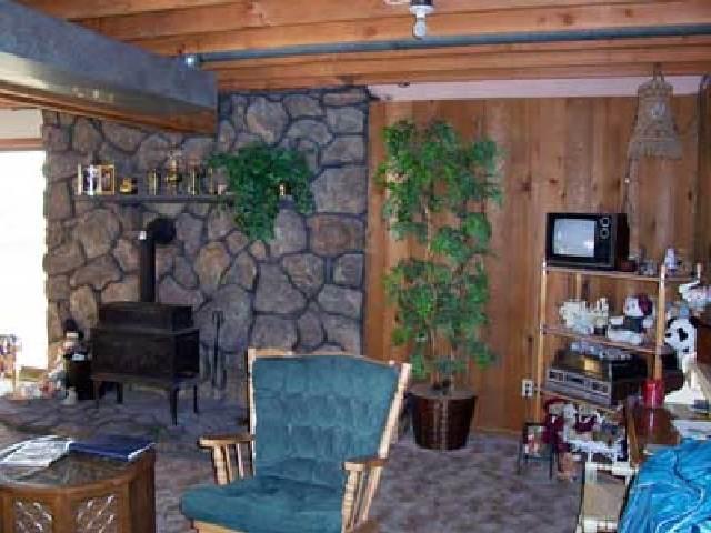 9450 Bittner Road Yakima, WA 98901 - Photo 5 of 9 a living room with furniture and a fireplace
