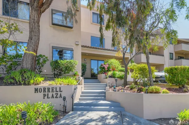 a vase of flowers sitting in front of a window