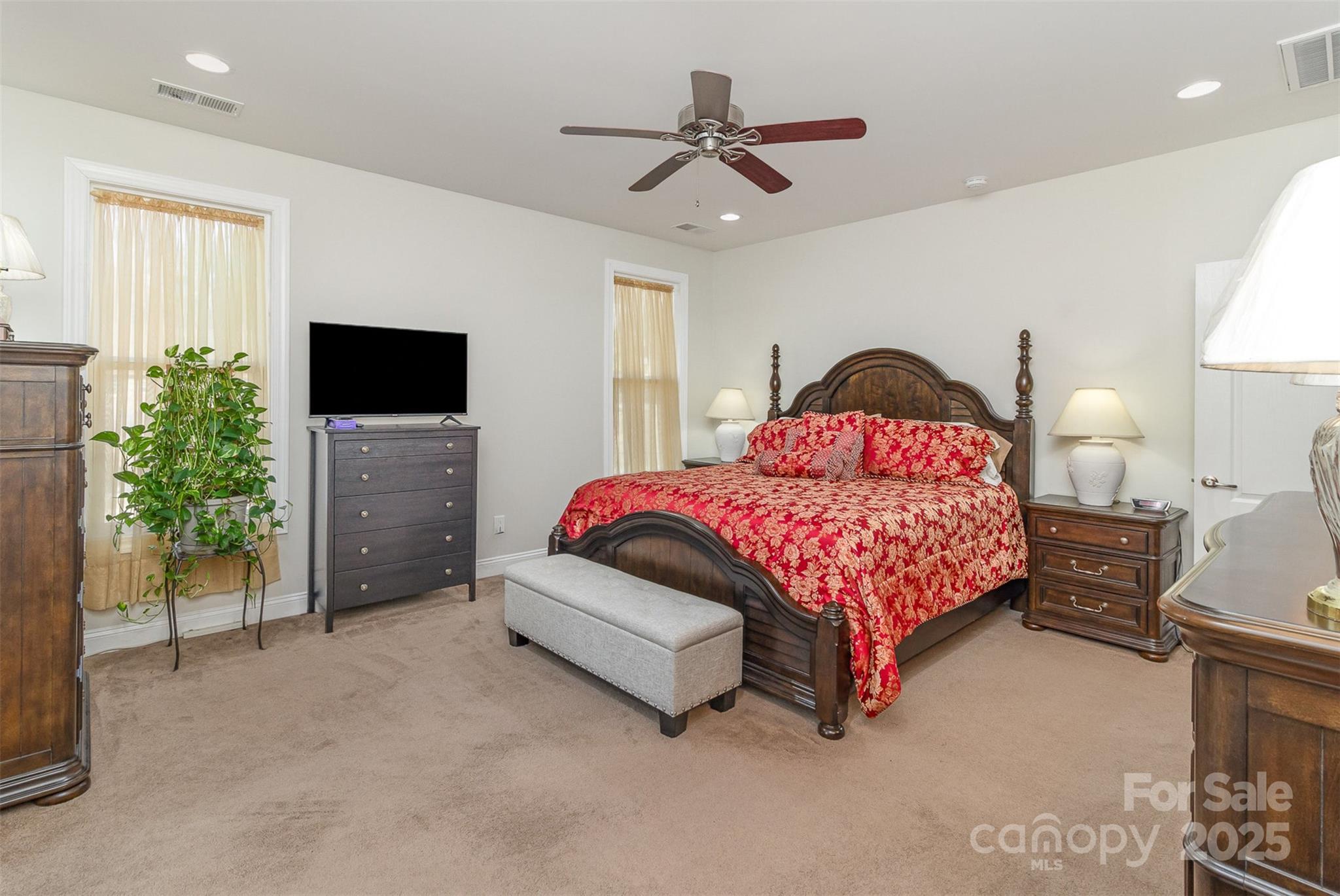 4321 Rolling Acres Road Charlotte, NC 28213 - Photo 11 of 22 a bedroom with a bed and a tv on table